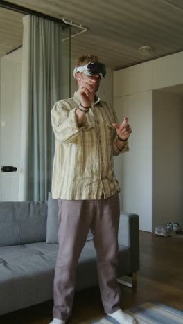 man wearing vr headset in a modern living room