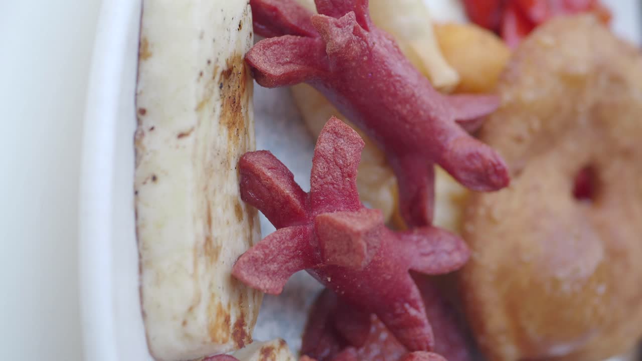 Food Platter with Sausages, Grilled Cheese, and Donuts