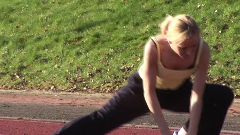 woman running at track and field competition