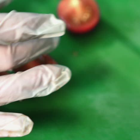 professional chef in a commercial kitchen cuts a tomato sqare video