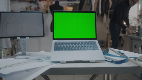 fashion design studio with laptop and tablet