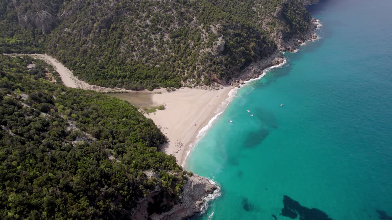 Aerial View of a Secluded Beach with Turquoise Water