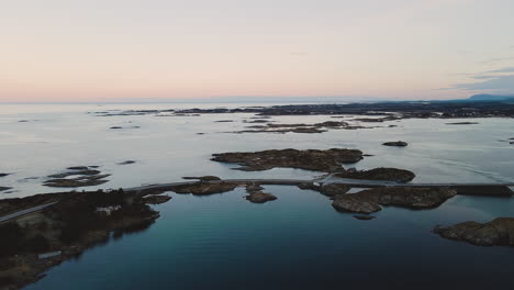 flying towards coastal highway of atlantic ocean road in atlanterhavsveien, norway during sunset