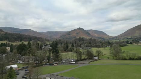 Wonderful-Lake-District-National-Park-Cinematic-aerial-video-footage-of-Grasmere-vlllage,-probably-Cumbria’s-most-popular-tourist-village