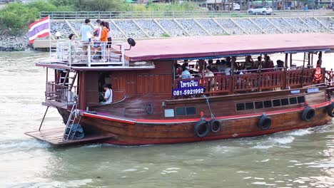 tourist boat cruising along ayutthaya river