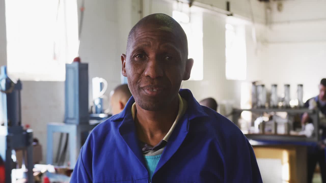 Front view of mixed race worker in factory