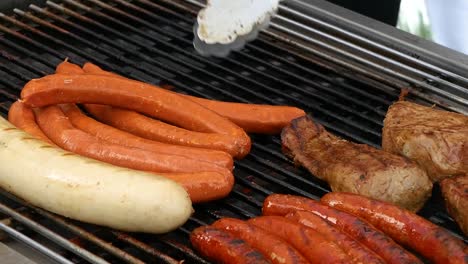 sausages are thrown on the grill