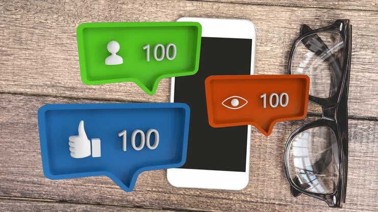 Different icons and a table with a mobile phone and eyeglass for social media