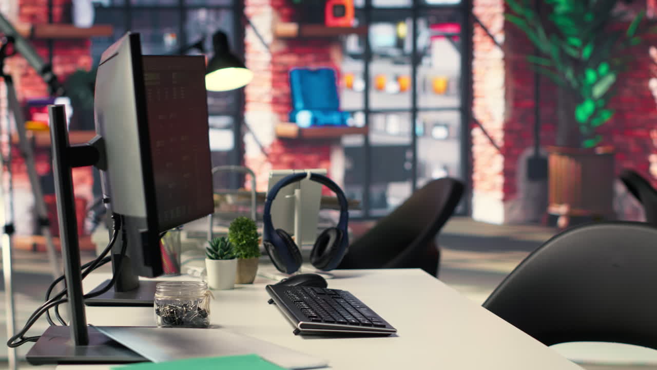 Empty desk for an expert technician with advanced computing visuals