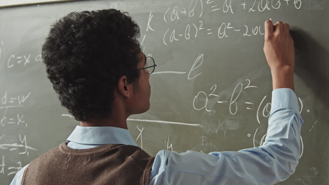 Smart Mixed-Race Student Solving Geometry Problem at Blackboard