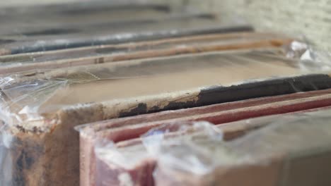 stacked vintage books in protective wrap