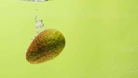 avocado in water with bubbles