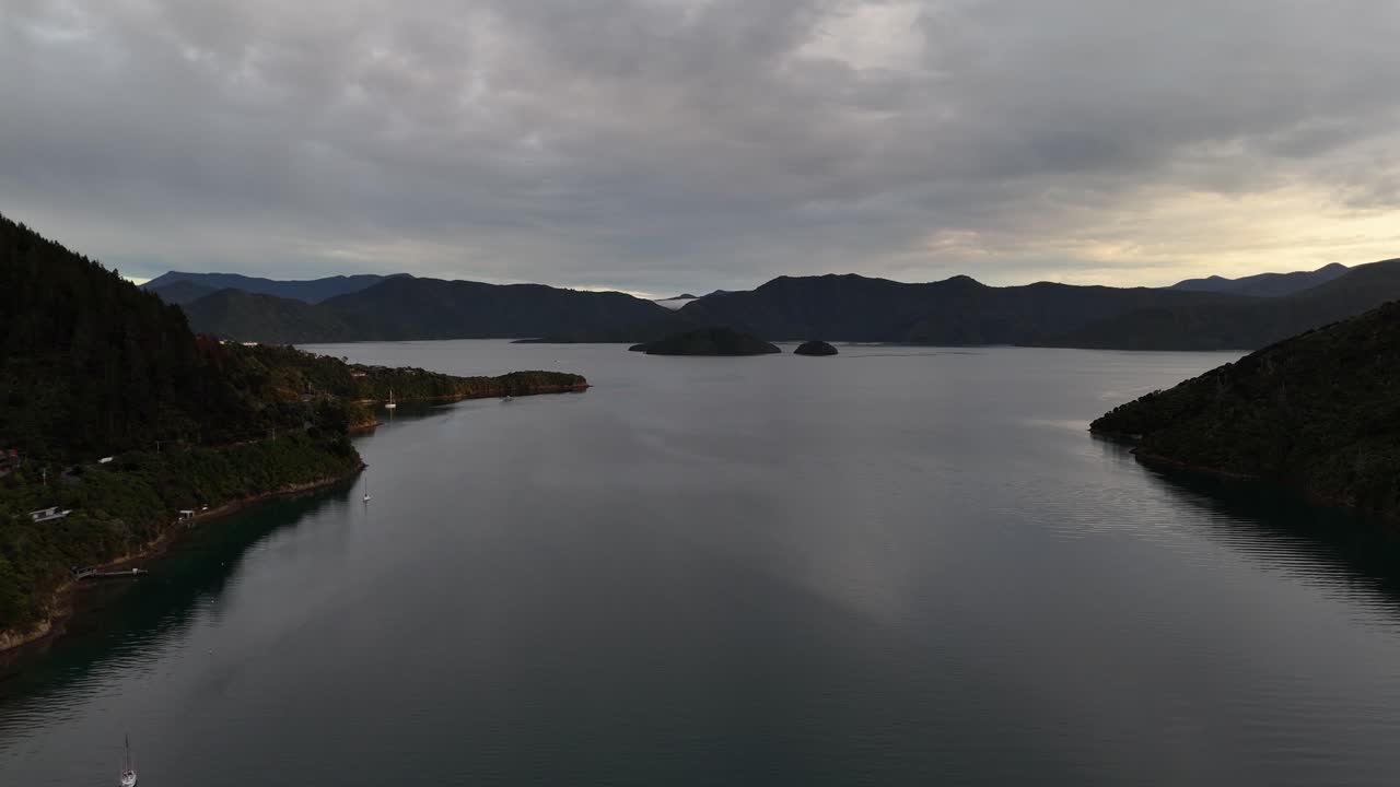 New Zealand's South Island, Picton Area: Breathtaking 4K drone footage captures majestic lakes nestled between mountains, showcasing the stunning natural beauty of this pristine landscape