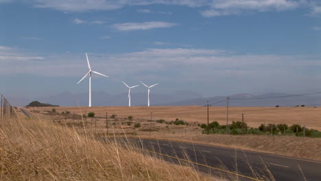 wind turbines in farmland and wheat fields