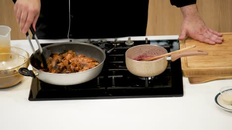 a chef prepares delicious chicken on the stovetop while a vibrant sauce simmers in a pot. the kitchen features a clean, contemporary design and well-organized tools