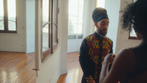 professional dancer giving tango class to young black woman