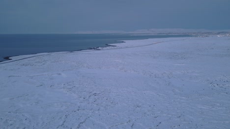 aerial view, snow-capped volcanic coast of iceland, reykjanes peninsula