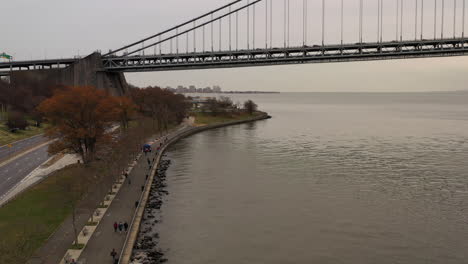 on a cloudy day the drone camera dollys in beside shore parkway