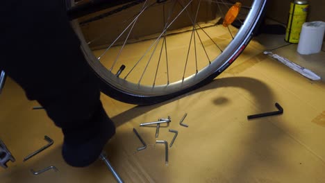 bicycle-with-a-flat-tire-is-placed-on-a-pape-for-repair