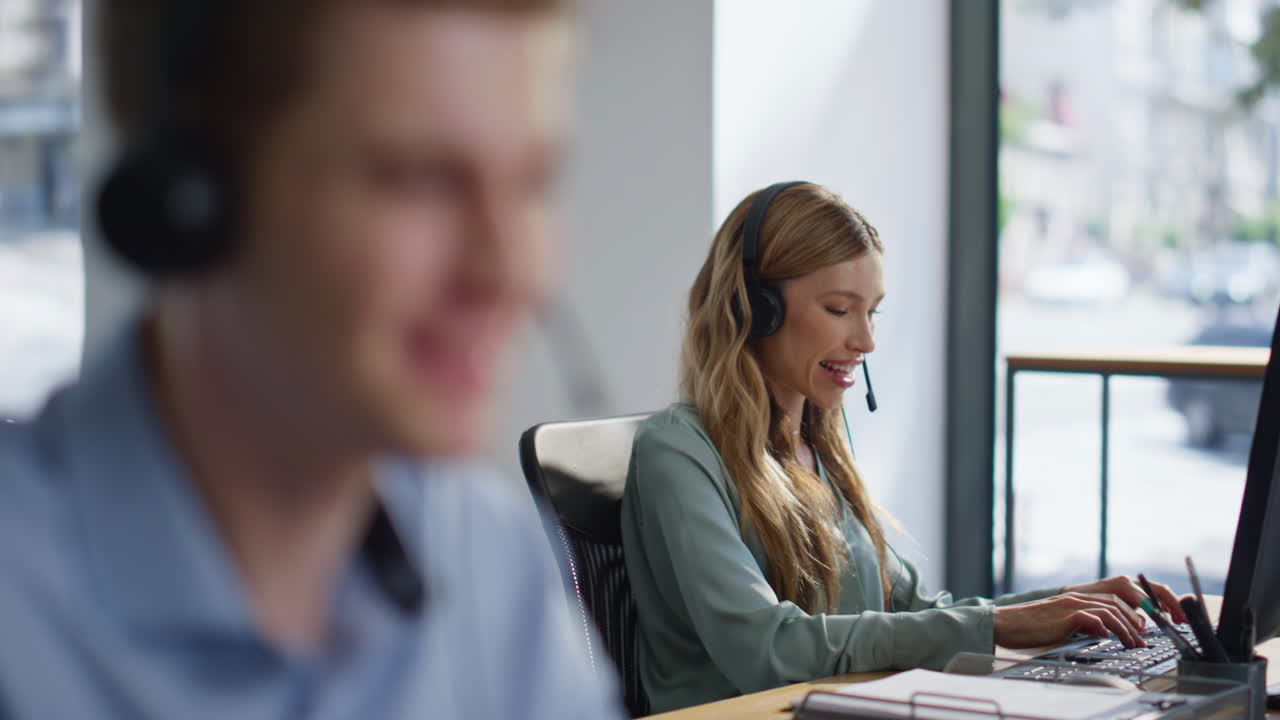 Helpdesk operators team talking in headset consulting clients in office closeup