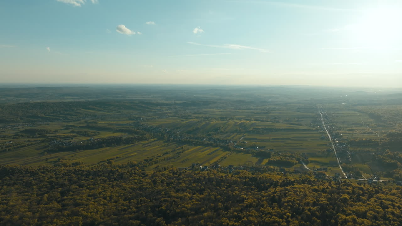 Aerial View of a Rural Landscape with Fields and a Village