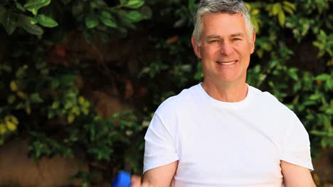 Mature-man-doing-exercise-with-dumbbells