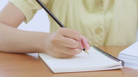 a focused moment of creativity as someone engages writing at home