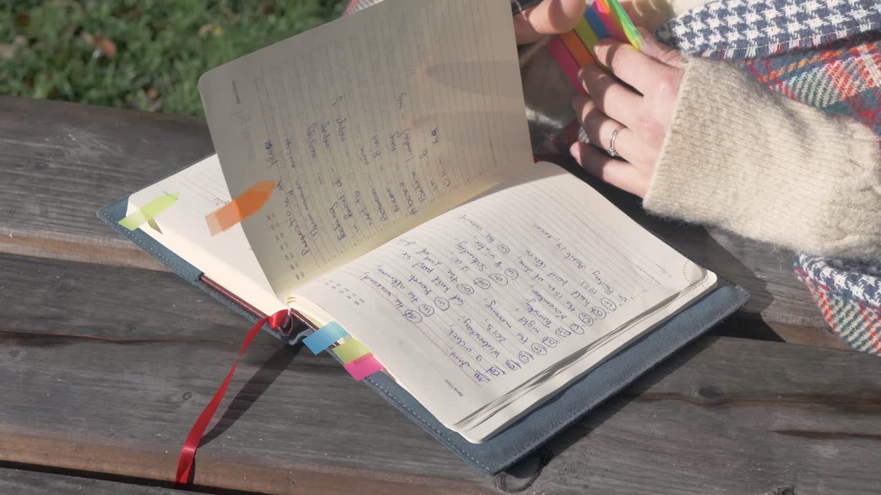 Female student looking through her notebook
