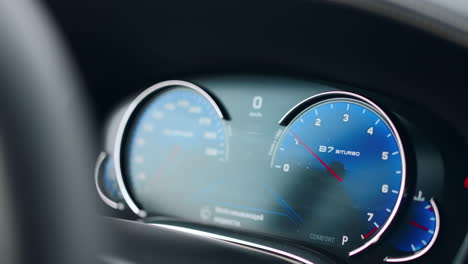 closeup tachometer showing number of revs. pointer displaying number of revs