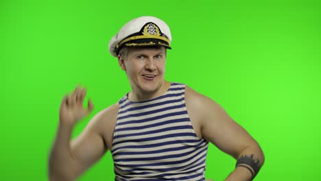 young sailor man dances and celebrates. seaman guy in sailor's vest. chroma key