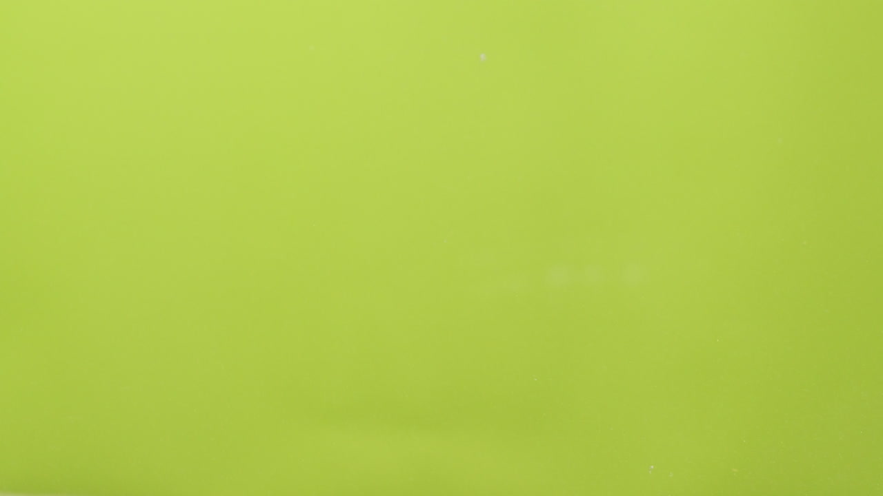 Avocados Splashing in Water