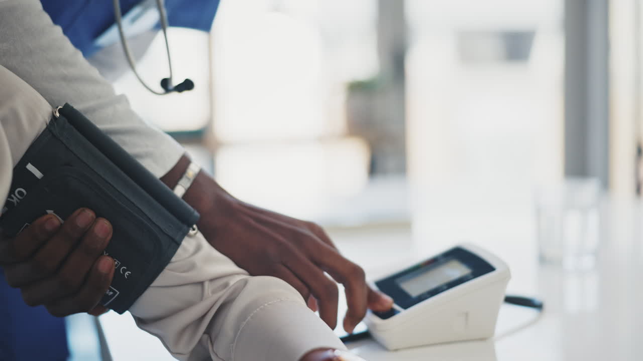 Doctor, patient and blood pressure at the hospital