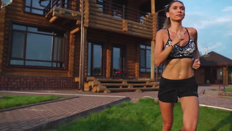 healthy lifestyle. girl running around in the morning in a premium residential area
