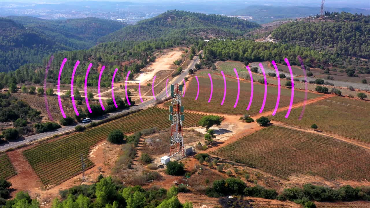 Cell Tower and Radio Waves Over a Rural Landscape