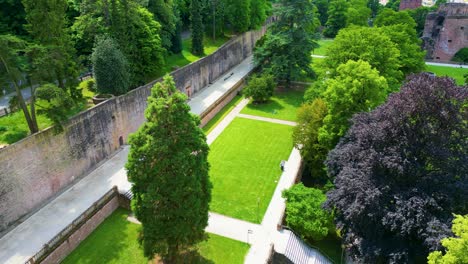 4k aerial drone video of gardens surrounding the historic castle on königstuhl hill overlooking heidelberg, germany