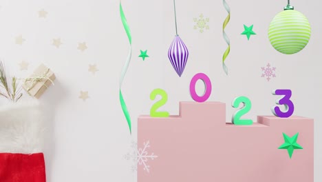 Animation-of-2023-text-and-christmas-decorations-in-background