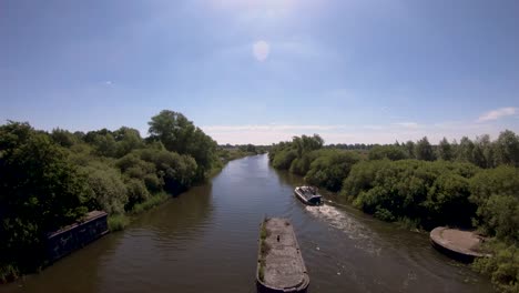 aerial drone footage of a boat along the river waveney, norfolk