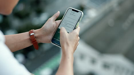 Phone,-screen-and-hands-of-man-typing-in-city