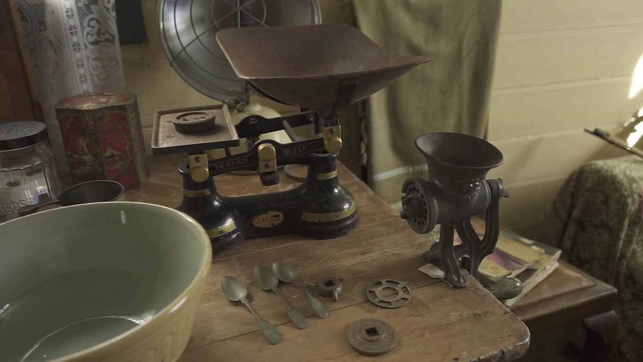 Antique Kitchen Scales and Grinder on Wooden Table