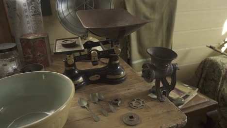 antique kitchen scales and grinder on wooden table