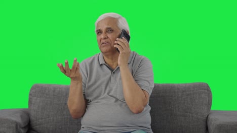 Indian-old-man-talking-on-phone-Green-screen