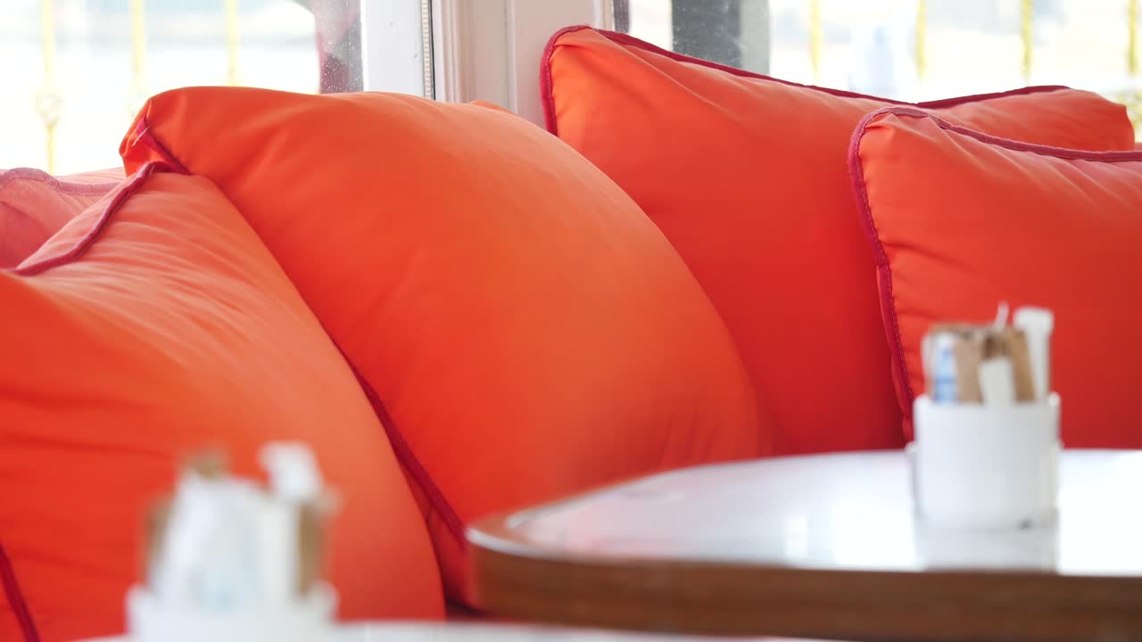 Orange Pillows in a Cafe