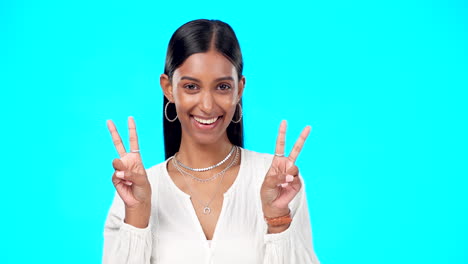 happy woman, peace and face wink in studio