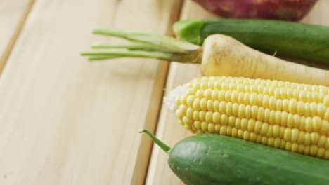 video of fresh vegetables with copy space over wooden background