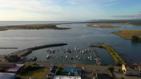 Aerial-Descending-Shot-of-harbor-in-Bandon,-Oregon,-USA