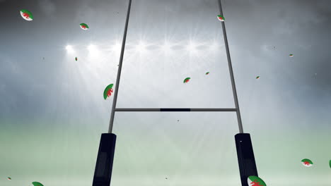 animation of rugby balls coloured with flag of wales at stadium