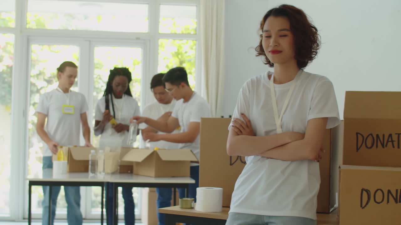 Portrait of Young Female Student Volunteering in Donation Organization