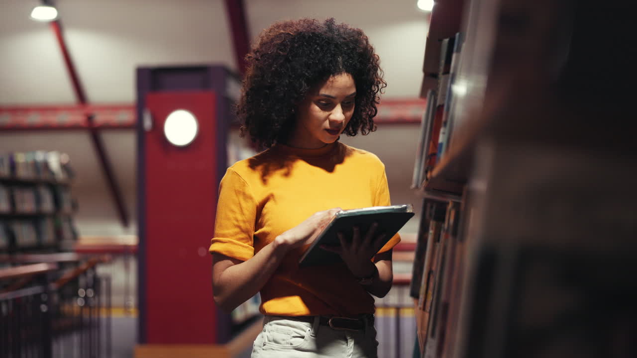 Woman Looking at Books in Library