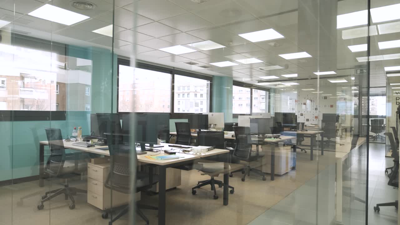 Interior of bright creative coworking workspace with computer desks