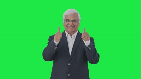 happy indian senior journalist showing thumbs up green screen